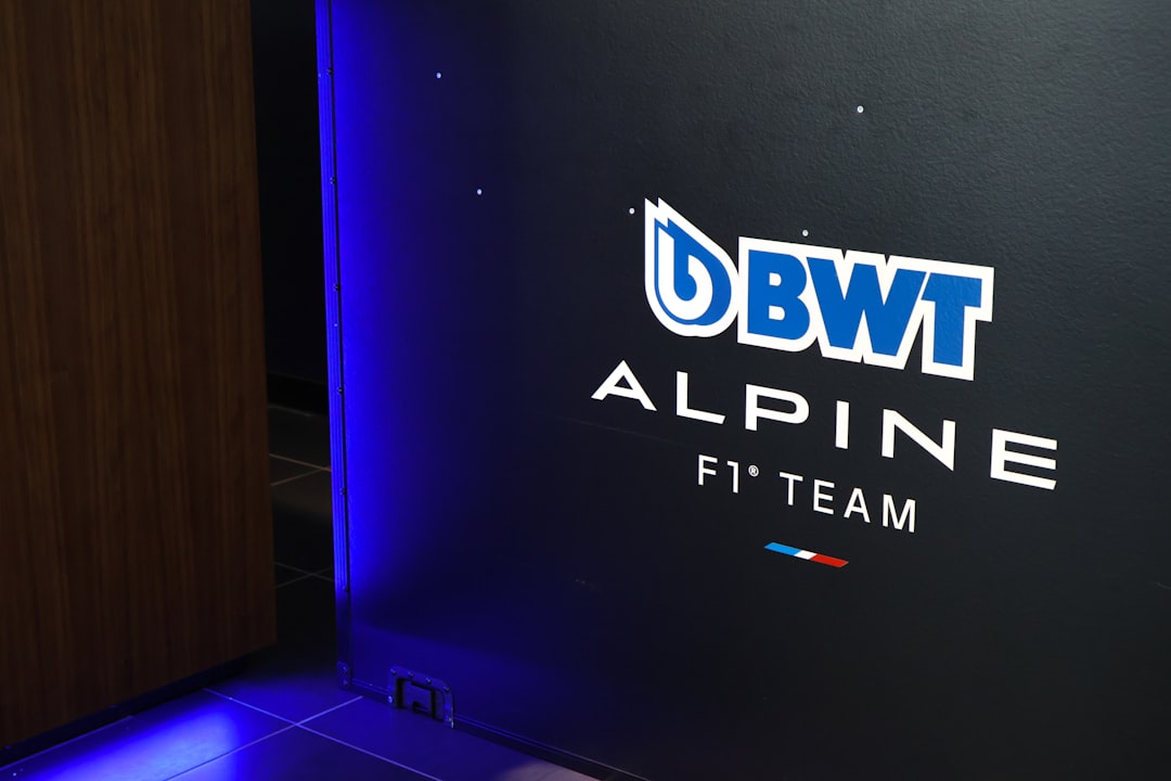 Bwt alpine f1 team logo on dark background